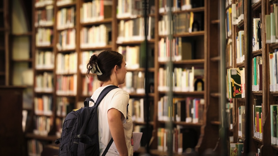  A student peruses the shelves at an Oxford library